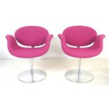 A pair of modern Artifort Tulip chairs, designed by Pierre Paulin, upholstered in pink fabric,