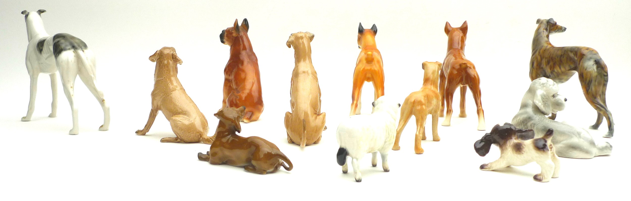A collection of ceramic animal figurines, all modelled as dogs, some marked, including two Goebel, - Image 2 of 11
