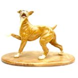 A ceramic figurine, with incised signature 'J Spouse', modelled as a brindle boxer dog in standing