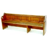 A 19th century pitch pine church pew, with each shaped pierced with a quatrefoil window, four