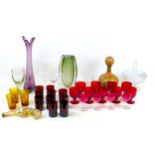 A collection of assorted glass wares, including two Whitefriars style vases, a tall violet vase,