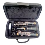 An SMS Academy, Scholarship Series five piece clarinet, 67cm long, with spare connector, in fitted