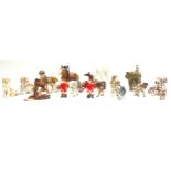 A collection of ceramic animal figurines, mostly German, including a Royal Dux elephant, 22cm by