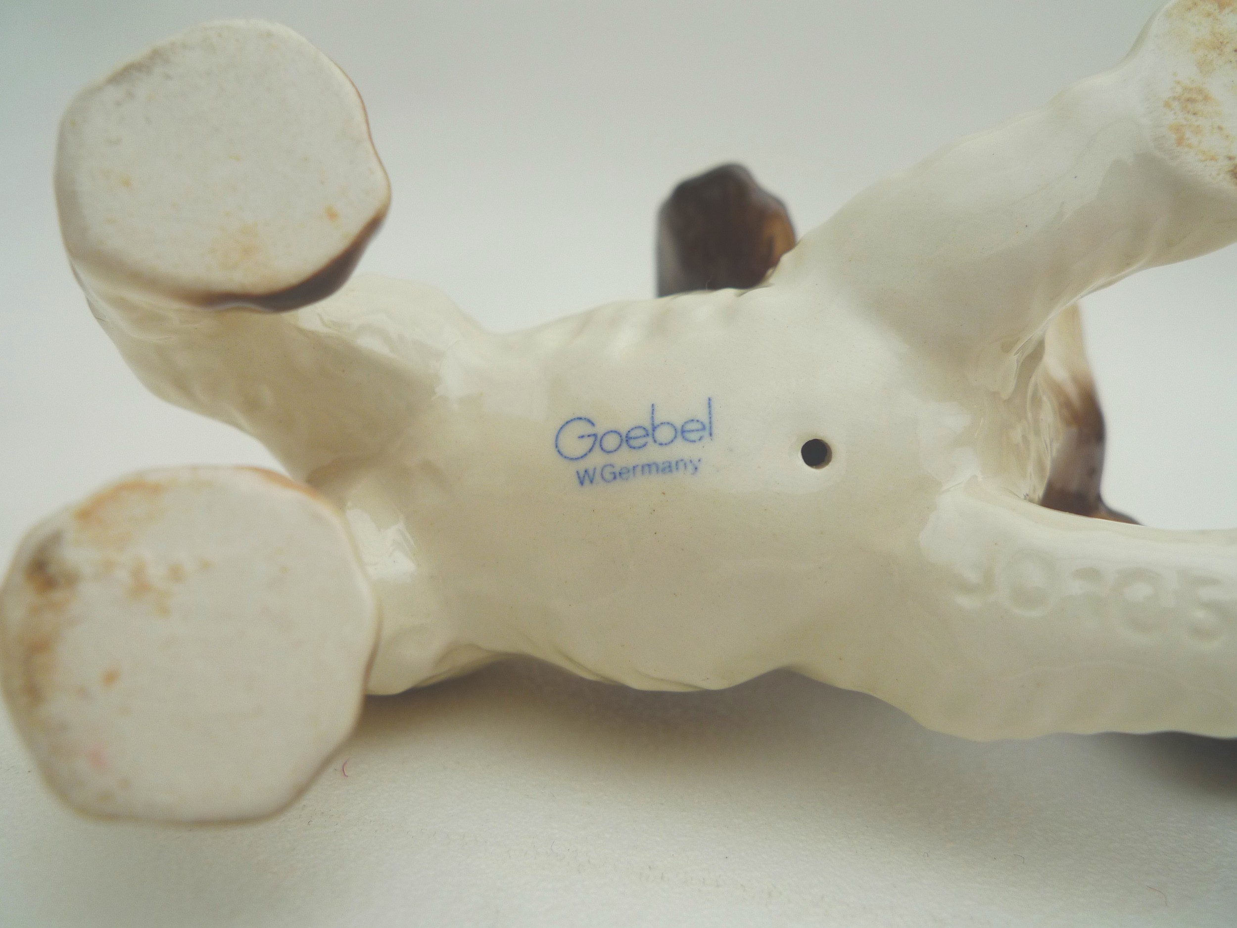 A collection of ceramic animal figurines, all modelled as dogs, some marked, including two Goebel, - Image 11 of 11