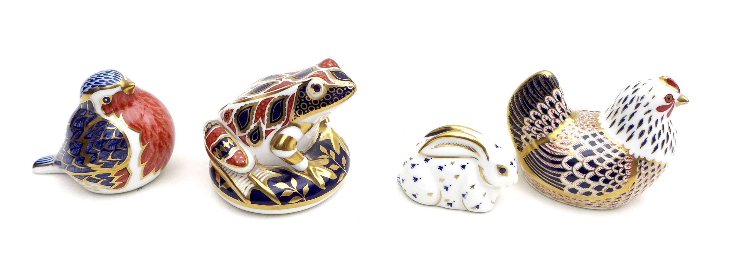 A group of four Royal Crown Derby paperweights, comprising a rabbit, with gold stopper, a frog, a