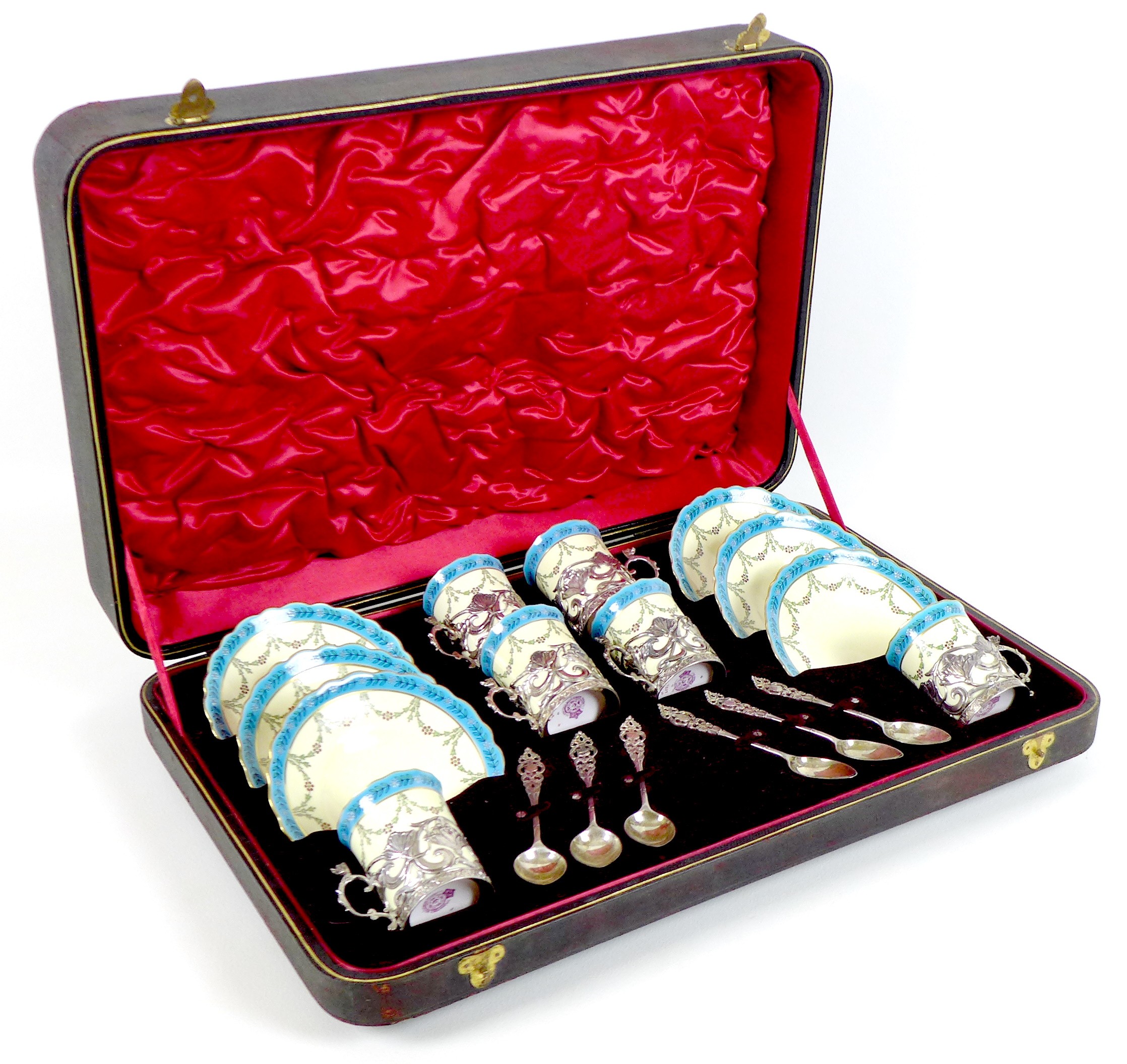 An Edwardian Royal Worcester porcelain and silver mounted coffee set, dated 1904, with scalloped