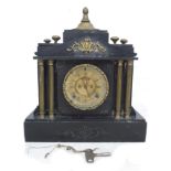 A Victorian slate mantel clock of architectural from, signed ' E. Earnshaw, Ilkley & Pairs',