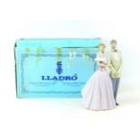 A Lladro figural group 'An evening Out', with impressed and number '53540' to its base, 17.5 by 20