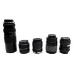 A group of camera lenses, comprising a Sigma 52mm, a Mirage 28mm, a Vivitar Macro 4x, a Mirage