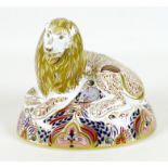 A Royal Crown Derby paperweight, modelled as 'Lion', LXI, no stopper, 14cm high, with associated