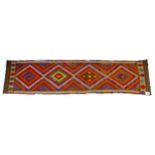 An old Suzni Kilim runner, with four central lozenges and with caucasian, orange, purple and blue