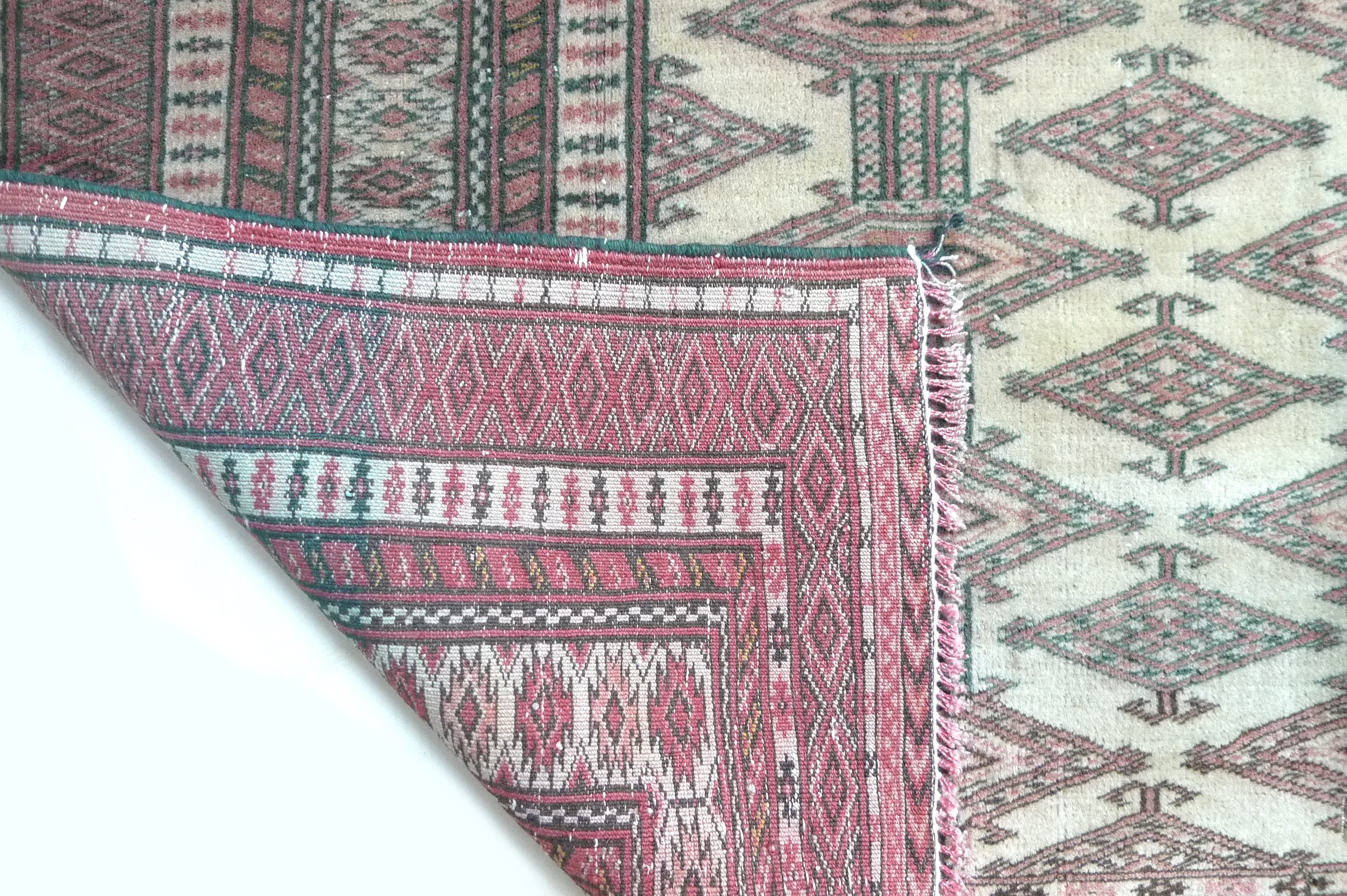 A Turkman rug with red ground and repeating central pattern, 165 by 118cm. - Image 2 of 2