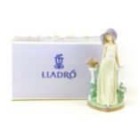 A Lladro figurine 'Time for Reflection', with maker's marks to base, 16 by 16.5 by 34.5cm high, with