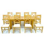 A modern oak extending dining table, 180 by 95 by 79cm high with two additional leaves, 240 by 95 by