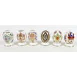 A group of six Royal Crown Derby paperweights, all modelled as 'Eggs of the World', all without