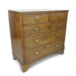 A George III oak chest of two short over three long graduating drawers, with brass plate handles and