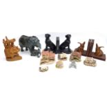 A group of collectables, comprising a hardstone elephant, 28cm long, a wooden elephant, two pairs of