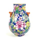 A small Chinese porcelain 'Hu' shaped vase, likely Republic period, decorated with a millefleurs