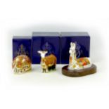 Three Royal Crown Derby paperweights, comprising one modelled as a Llama, an exclusive for the Royal