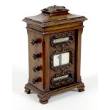 An Edwardian mahogany perpetual desk calendar, of pillar form with an acanthus topped sarcophagus '