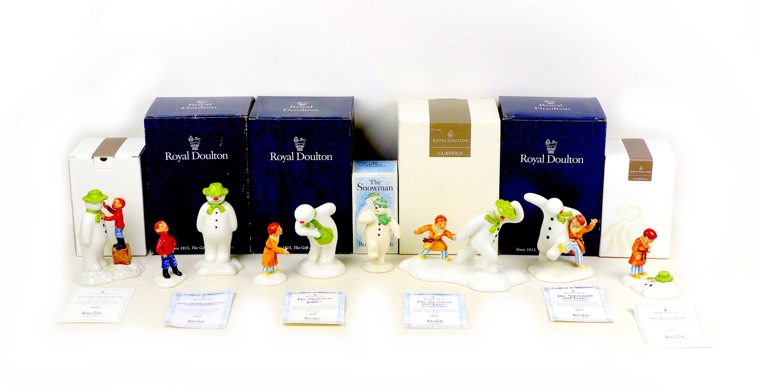 A group of seven Royal Doulton ?The Snowman? figural groups, comprising six limited edition sets, ?