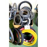 A group of BMX and children's bicycle tyres, including a pair of red and a pair of yellow Duro