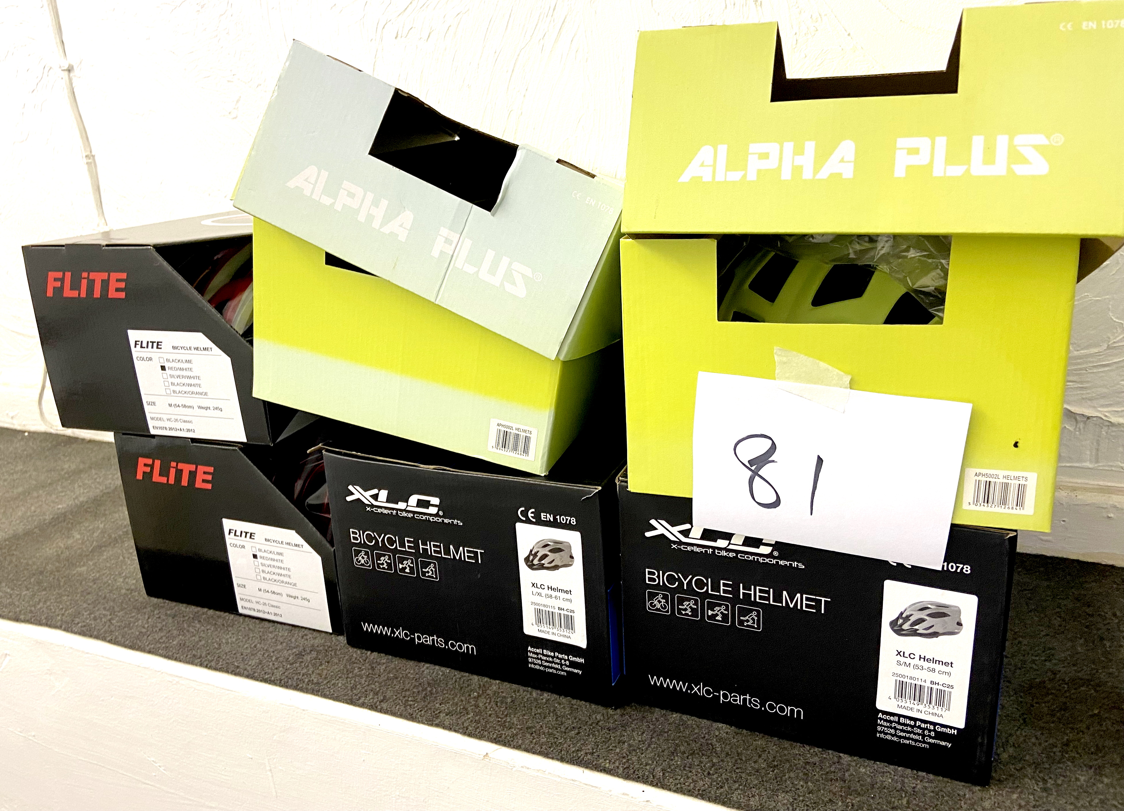 A group of six boxed bike helmets, comprising two Flite HC-26 Classic, two Alpha APH5002L, and two