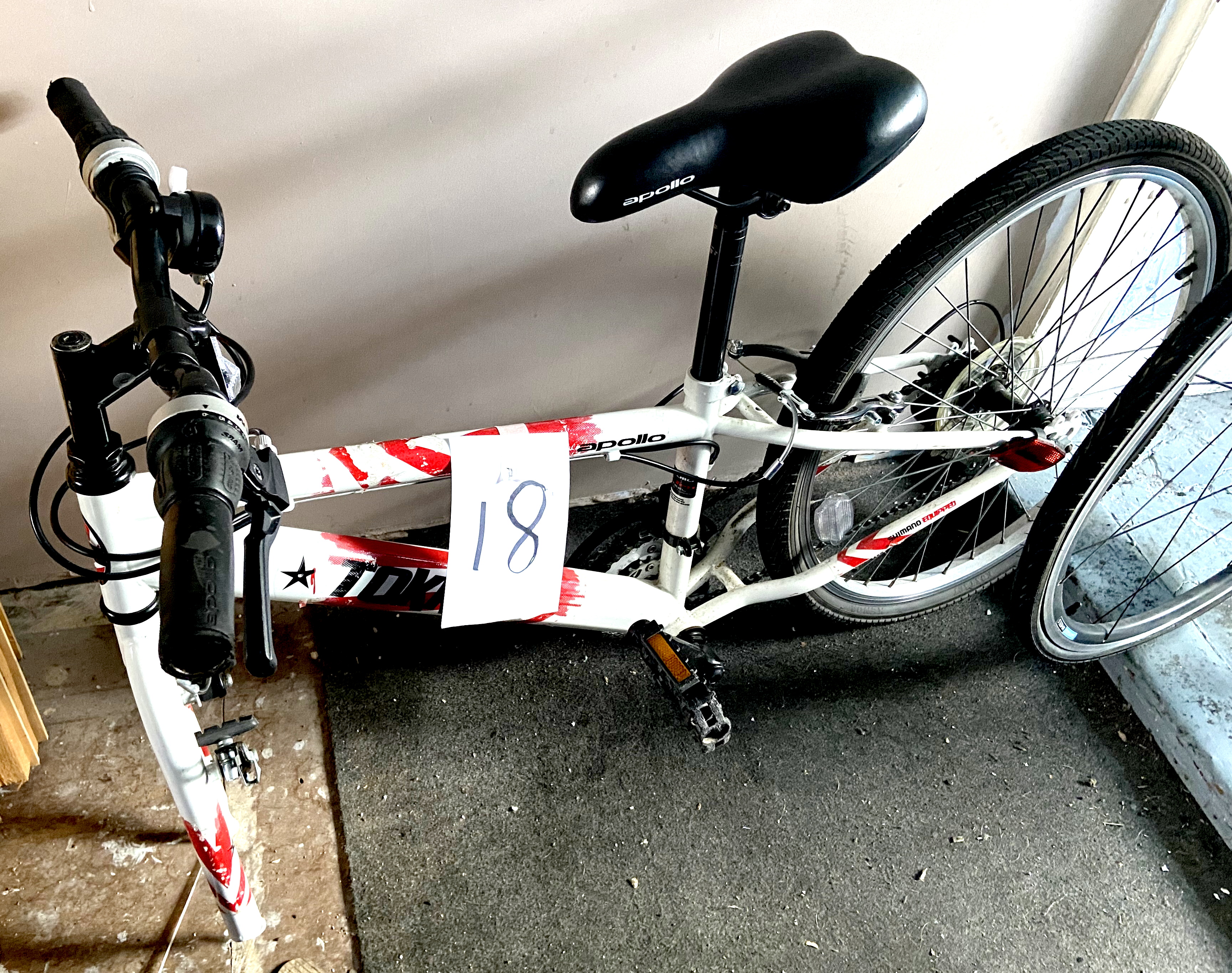 A Tokko Apollo white painted gent's mountain bike, missing front wheel.