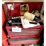 A red metal tool chest, with contents.