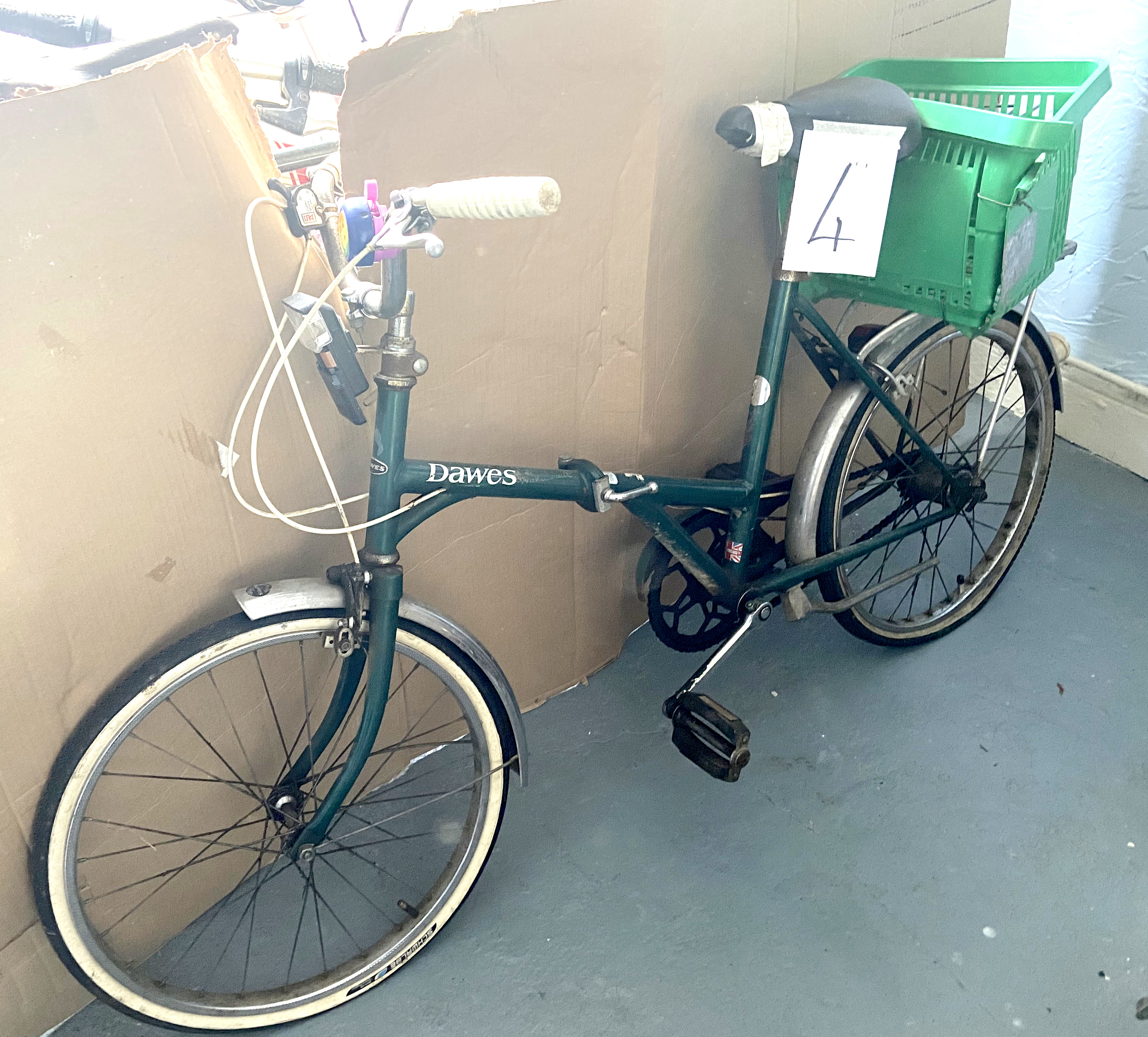 A vintage Dawes green painted lady's shopper bike.