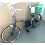 A vintage Dawes green painted lady's shopper bike.