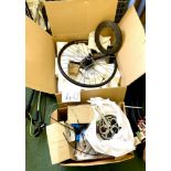 Two cardboard boxes containing a variety of bike parts, including a D.H.Disc wheel and rear gear