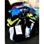 A quantity of cycling apparel, mostly men's jerseys.