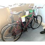A Specialized Stumpjumper dark red painted gent's mountain bike, with front suspension.