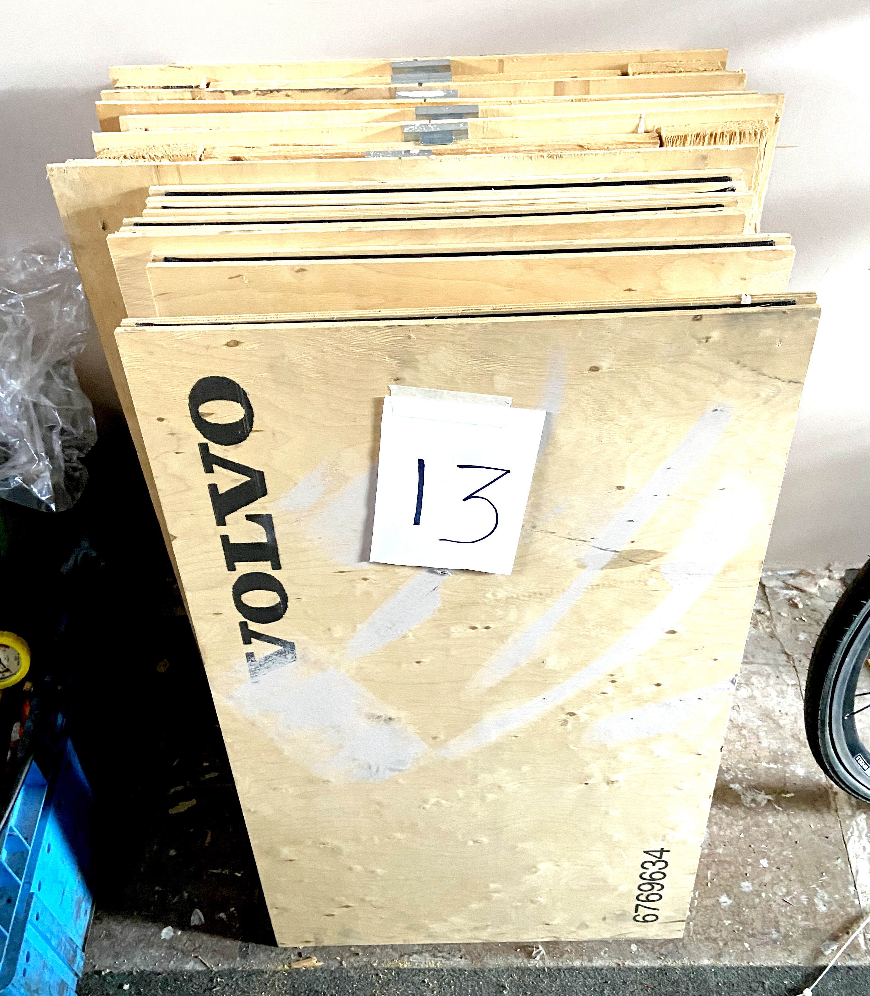 A group of six Volvo branded folding plywood boxes / crates.