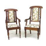 A pair of Victorian lady's and gentleman's mahogany open armchairs, with curved rolled top and