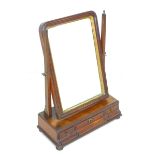 A George III mahogany toilet mirror, the rectangular plate with moulded frame and gilt slip, the