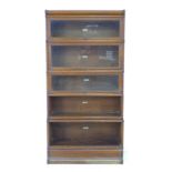 A Globe Wernicke bookcase, mid 20th century, in five graduating sections with fold away glazed