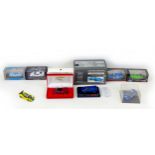 A group of eight 1/43 scale die-cast model cars, including a Minichamps BMW M1 Street and a