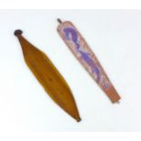 Two early 20th century Aboriginal woomerah spear throwers, comprising a hand painted example,