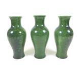 A set of three matching mottled green glazed table lamp bases, mid 20th century, of baluster form