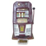 A vintage Sega Copper one armed bandit fruit machine, with coins and key, 41 by 39 by 67cm high.