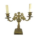 A French late 19th century gilt metal twin branch table lamp, with floral scrolling decoration and