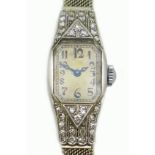 An Art Deco Longines platinum and diamond set lady's cocktail watch,the tank shaped case set with