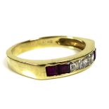 A 14ct gold ring set with four rubies and three white stones, all princess cut, size P/Q, 3.1g.