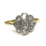 A nine stone diamond daisy ring