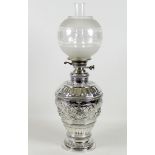 A large and impressive 19th century silver paraffin lamp