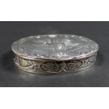 An Edwardian silver box, of oval section with hinged cover