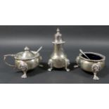 An Elizabeth II silver three piece cruet set, comprising tower pepperette, the removable finialled