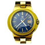 A gold plated Omega Automatic De Ville Dynamic wristwatch, blue face with gold batons, on an